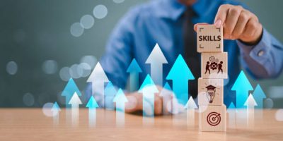 Skill competency development concept. Up new ability skill training for technology evolution. Leadership thinking upskill. Hand hold wooden cube, soft skill digital icon. Education learning talent